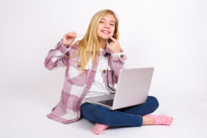 Girl Holding Clear Aligners