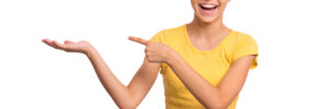 Teen girl smiling in yellow shirt on white background